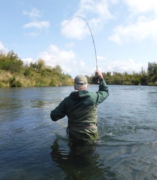 Mike into a lively rainbow downriver on a small Adams.
